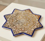 Unique Persian lustreware star tile inspired by Ilkhanid ceramic art and decorated with a traditional golden medallion design.